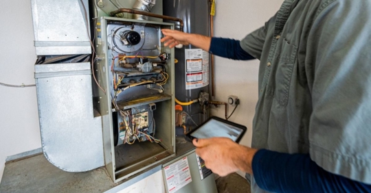 Man checking a furnace