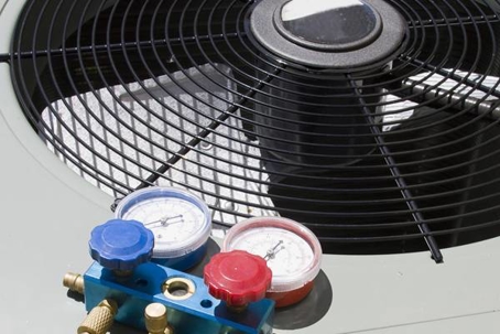 Close-up of HVAC equipment, indicating maintenance or repair.