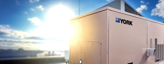 Rooftop HVAC system in the sun, with "YORK" branding clearly displayed on the side.